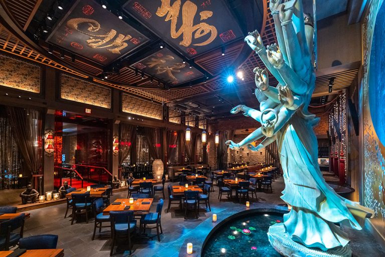 TAO The main dinng room anchored by the 16 foot tall Quan Yin statue resized 768x512