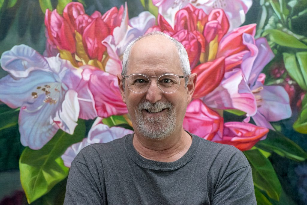 Paul Baldassini (photo of artist in front of one of his works)