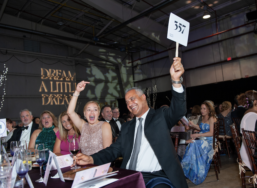 Excited bidders at The Bushnell's Ovations gala 2021. Photo by Roger Castonguay for the Defining Photo.