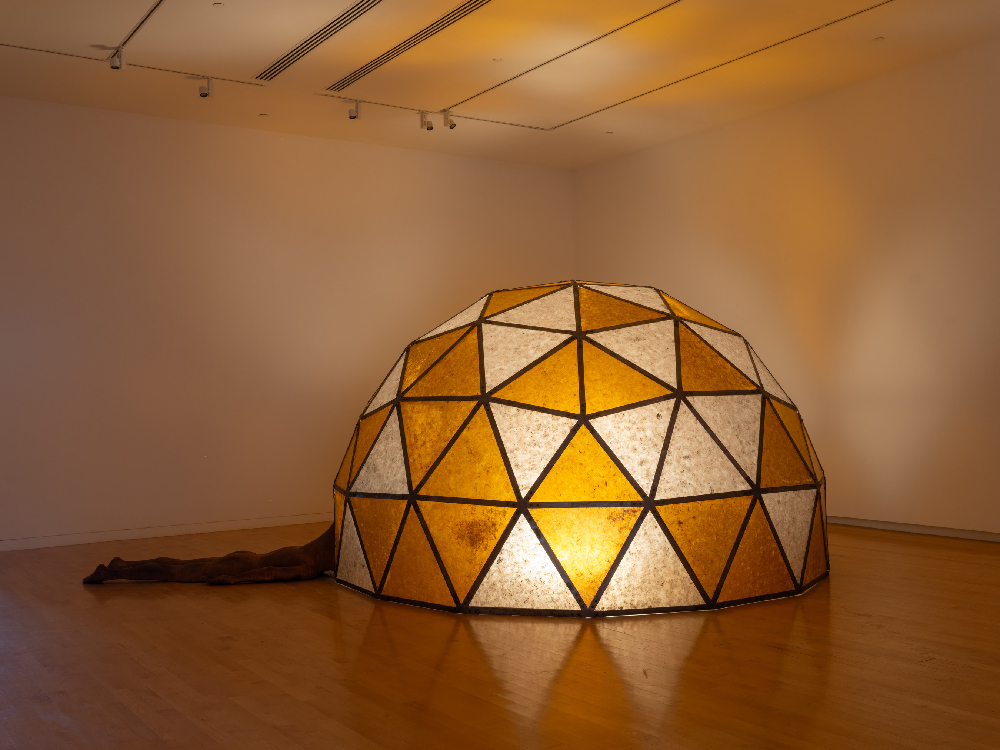Chiffon Thomas, Untitled (Dome, Figure 1), 2023. Polyurethane resin, mica sheets, steel,
and LED lighting system, 120 x 144 x 228. Courtesy of the artist and Kohn Gallery,
Los Angeles. Photo: Jason Mandella