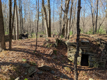 Ruins of former farms are scattered across the Land Trust property