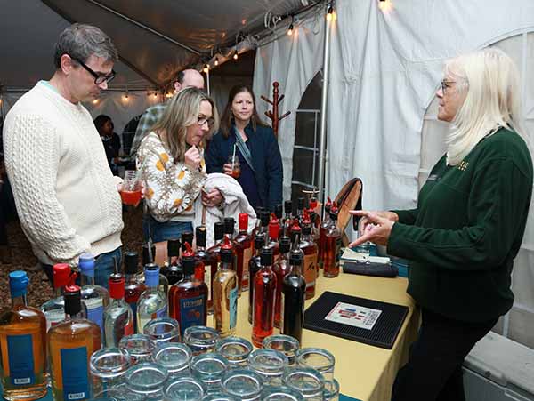 Representative  from Litchfield Distillery offering drinks to guests_Harvest Moon photo by Regina Calderone