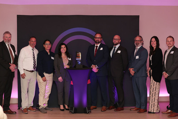 BMS Aerospace took home ManufactureCT's inaugural Innovation Award. (Tina Bracone, president of BMS Aerospace, is left of trophy.)